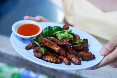 Close-up of hand holding food