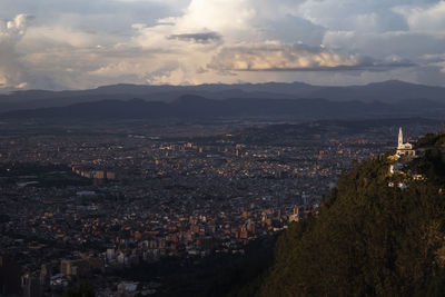 City scape with church in foreground over bogota colombia at sunset