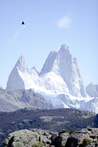 Scenic view of snowcapped mountains against clear sky