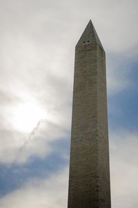 Low angle view of building against cloudy sky