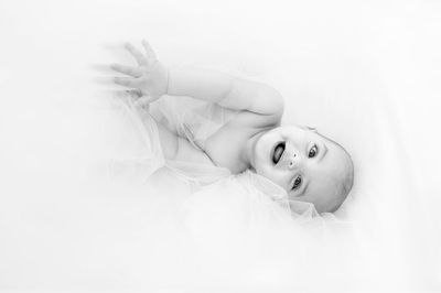 Close-up portrait of smiling baby boy