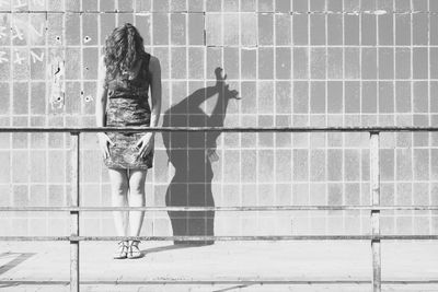Men standing against wall