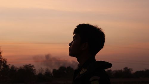 Portrait of silhouette man against sky during sunset