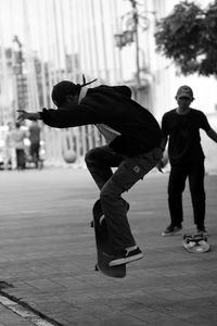 Young man  skating on the street in the city