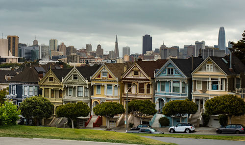 Buildings in city against sky