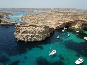 High angle view of sailboats in sea