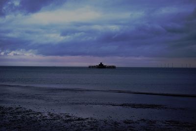 Scenic view of sea against cloudy sky