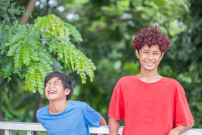 Portrait of happy boy smiling outdoors