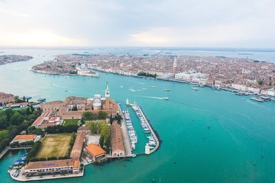 High angle view of city against cloudy sky