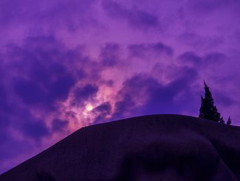 Low angle view of cloudy sky at sunset