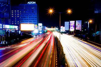 Light trails on city street at night