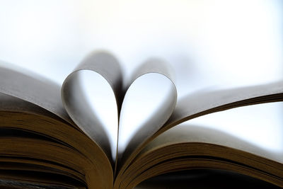 Close-up of heart shape on book