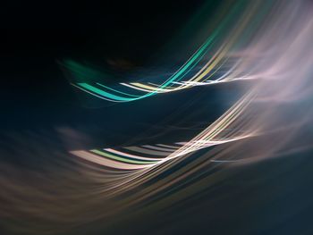 Close-up of light painting against black background