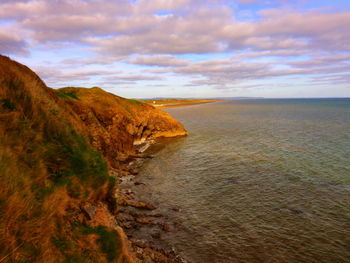 Scenic view of beach against sky