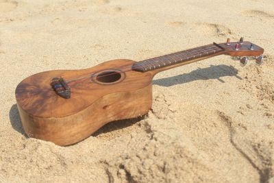 High angle view of shoe on sand at beach