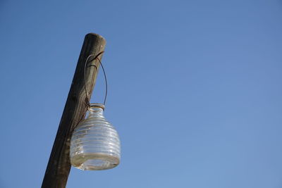 Low angle view of tree against clear blue sky