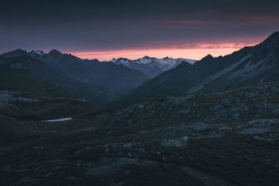 Scenic view of mountains against sky at sunset