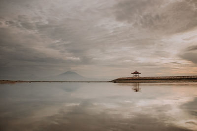 View of lake against cloudy sky