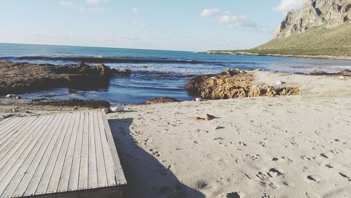 Scenic view of beach against sky