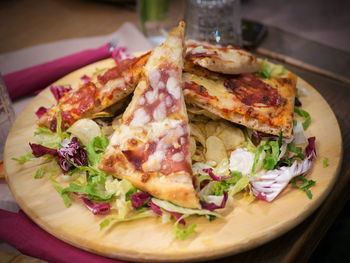 High angle view of pizza in plate on table