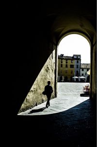 Woman standing in front of building