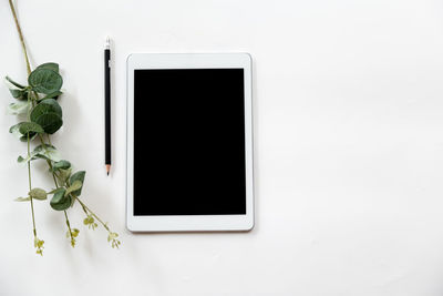 Directly above view of white and laptop