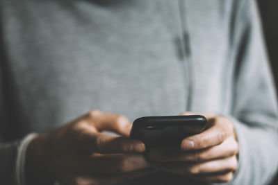 Close-up of man using mobile phone