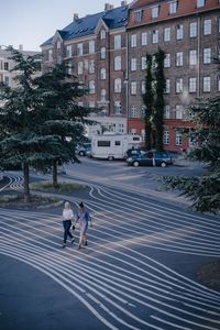 People crossing street in city