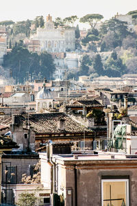 Houses in city against sky