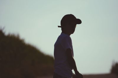 Full length of silhouette man standing against clear sky