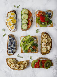 Directly above shot of open faced sandwiches on table