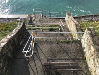 High angle view of steps by water