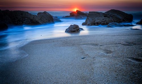 Scenic view of sea against sky during sunset