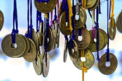 Close-up of wind chime hanging outdoors