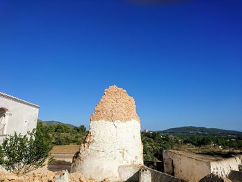 View of castle against clear blue sky