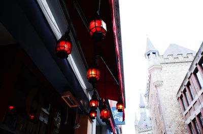 Low angle view of illuminated buildings against sky