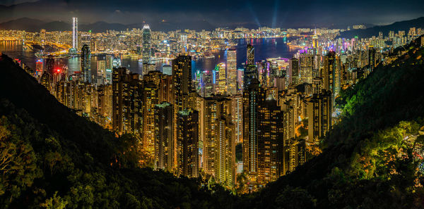 High angle view of illuminated buildings in city at night