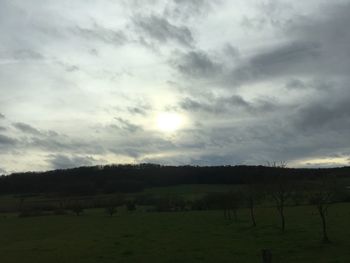 Scenic view of field against sky during sunset