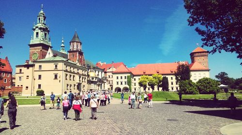 Tourists in front of building