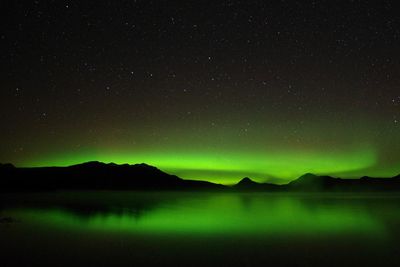 Scenic view of lake against star field at night