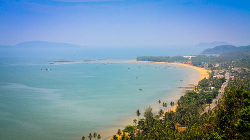 High angle view of bay against blue sky