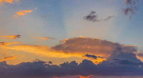 Low angle view of dramatic sky during sunset