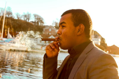 Portrait of man smoking cigar