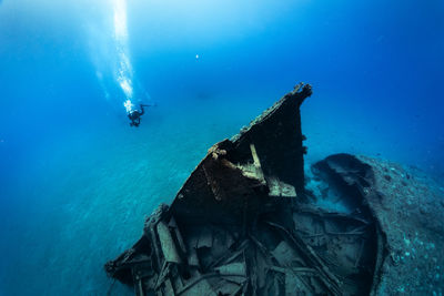 Woman scuba diving in sea