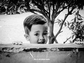 Portrait of boy against plants