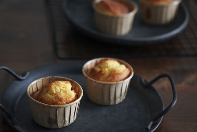 There are several delicious lemon honey cupcakes just made on the table