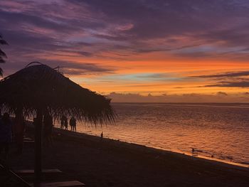 Scenic view of beach against sky during sunset