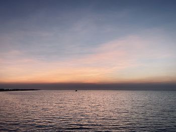 Scenic view of sea against sky at sunset