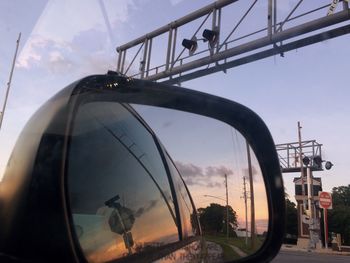 Close-up of cars on city against sky