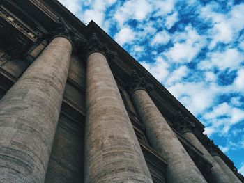 Low angle view of building against cloudy sky